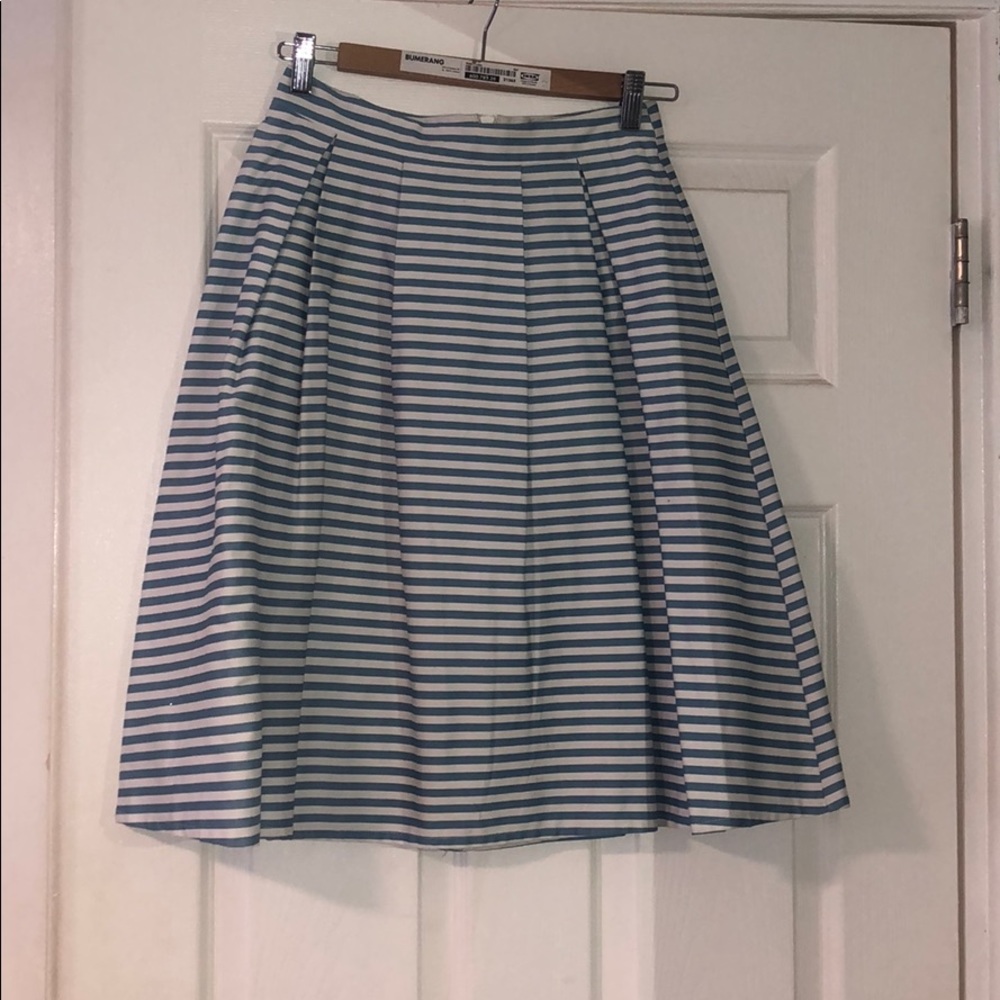White and sky blue skirt.